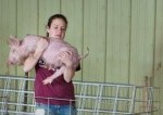 UW-River Falls girl holds pig