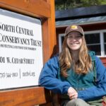 Photo of Morgan Goff, a junior conservation and community planning major at UW-Stevens Point, who is an intern at the North Central Conservancy Trust in Stevens Point.