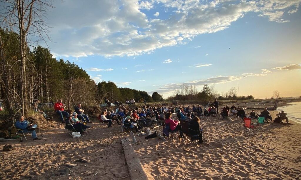 Photo of community members working on a land restoration initiative, UW-Superior