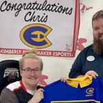 Photo of UW-Eau Claire esports gamer: First-year student Christopher Brockert, left, received a $2,000 esports scholarship for the 2024-25 academic year. Nate Garvey, right, advisor for the university’s Esports Club, was at Kimberly High School for Brockert’s signing day.