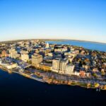 Photo of downtown Madison and UW-Madison campus, aerial view. The $49 million in Phase 2 funding to the Wisconsin Biohealth Tech Hub is expected to drive transformative medical innovation, workforce development and critical job growth across Wisconsin. Photo: Bryce Richter