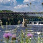 Photo of the 900-foot-long High Bridge that spans the Chippewa River just downriver from Dell’s Dam, which is officially named the Chicago, St. Paul, Minneapolis and Omaha Railway Bridge, but is referred to locally as the High Bridge because its deck is approximately 80 feet above the normal river level.