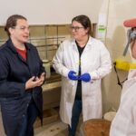 Photo of (from left) Dr. Deidra Gerlach, associate professor of chemistry and biochemistry, working with students Jackie Bradley and Connor Koepp.