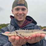 Photo of Zach Nordstrom, part of the Lake Sturgeon conservation research at UW-Green Bay.