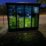 A six-panel, stained-glass mosaic enclosure was designed by UW-Eau Claire Jyl Kelley, professor of art, and fabricated by art students Theron Christiansen, Erin Phelps and Anmarie “Rie” Roos.