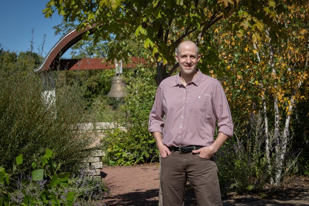 Photo of Aaron Kadoch, a professor of interior architecture at UWSP, who was the principal designer for the Cultural Commons interactive garden, located in Pfiffner Park on the Stevens Point riverfront.