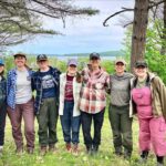 Photo of Heather Walder, whose expertise in advanced archaeological techniques has illuminated Indigenous-European interactions during a pivotal time in history. Here Walder is pictured with students during a six-week field program, Gete Anishinaabe Izhichigewin Community Archaeology Project (GAICAP) in Red Cliff, Wisconsin. From left: Kirsten Amann, Kim Thompson, Erin Seliger, Sabrina Neurock, Margaret Hanson, Heather Walder, Faith Kalvig