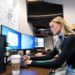 Photo of University of Wisconsin Oshkosh senior Abigail “Abi” Thede, who spends part of each week at her internship with the Winnebago County Sheriff’s Office, where she researches fraud cases and assists detectives with a variety of tasks.