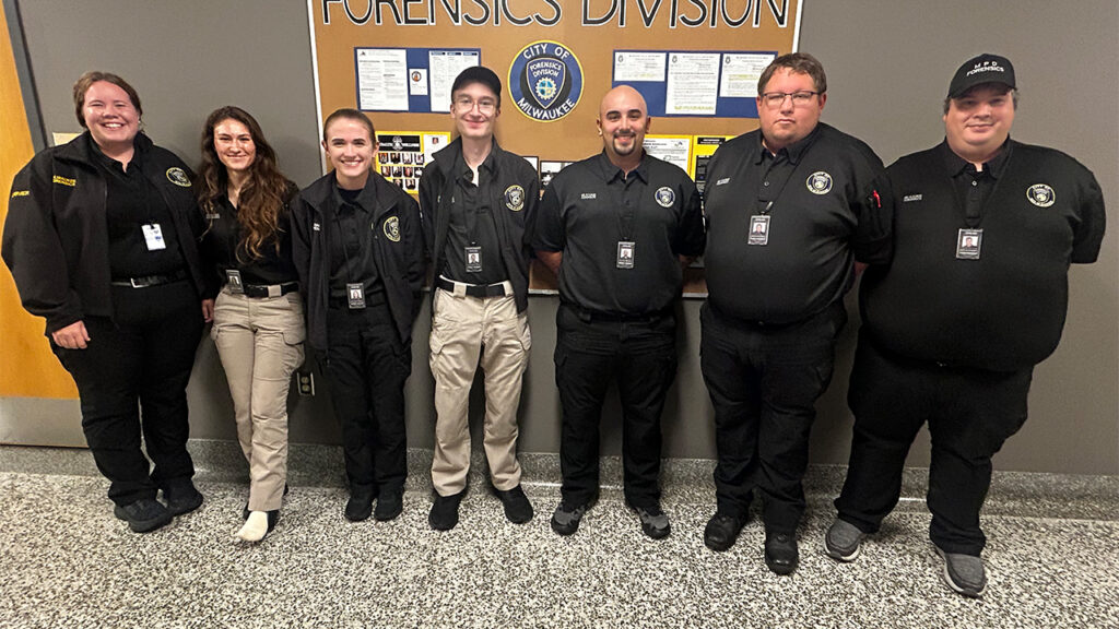 Photo of UW-Platteville graduates: Cassie Strandberg, Evelyn Marx, Whitney Miller, Dondi Stender, Devin Woida, Tyler Krueger and Jacob Brandt. “Each graduate brings their own unique skills, personality and approach to our team,” said Milwaukee Police Forensics Services Director Ryan Orlovsky.