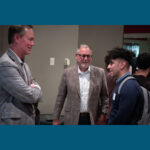 Photo of a UW-Green Bay student speaking with Mark Rourke, President and CEO of Schneider National about the Master's of Science in Supply Chain Management at the "Bridging Success Through Leadership" speaker series event on the Green Bay campus. Photo courtesy of Dan Moore, University Photographer.