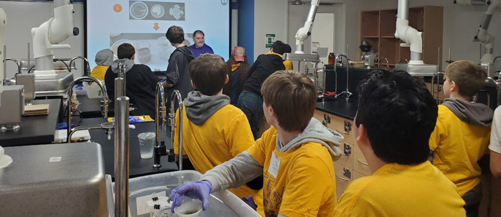 Photo of local middle school students learning about PFAS during a workshop at UW-Stevens Point's STEAM Day.