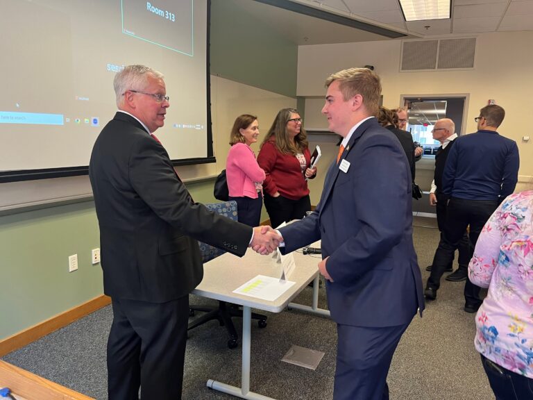 
President Rothman talks with a student representative after the Universities of Wisconsin Shared Governance meeting joint session on October 18, 2024, at the Pyle Center in Madison.
