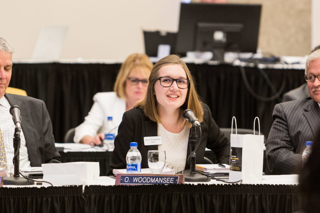 Photo of Regent Olivia Woodmansee, a student at UW-La Crosse, being welcomed as a new member of the Board of Regents. (Photo by Mikaila Dusenberry/UW-Milwaukee)